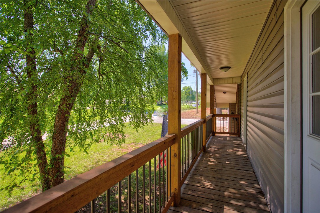 712 Beech Drive Seneca, SC 29678 - Photo 29 of 41 A welcoming front porch, shaded by mature trees, provides an ideal spot for relaxation.