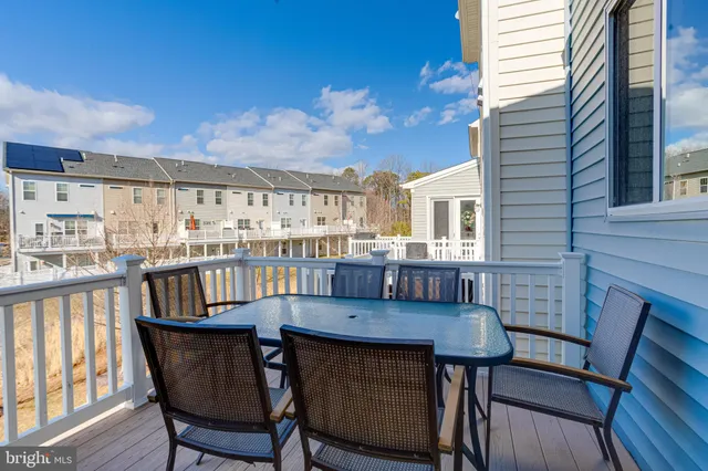 a view of a balcony with furniture
