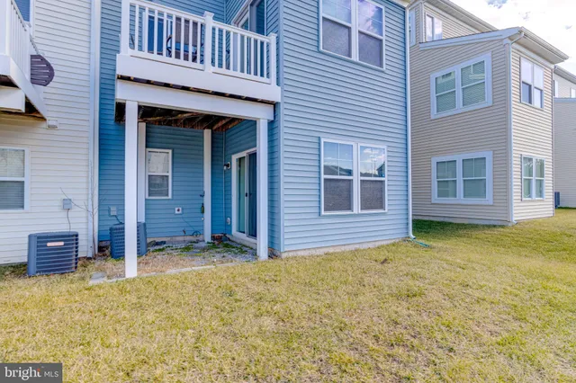 a view of an house with backyard of the house