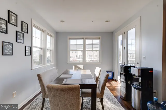 a view of a a dining room with furniture window and outside view