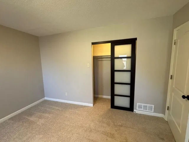 a bathroom with a double vanity sink and mirror