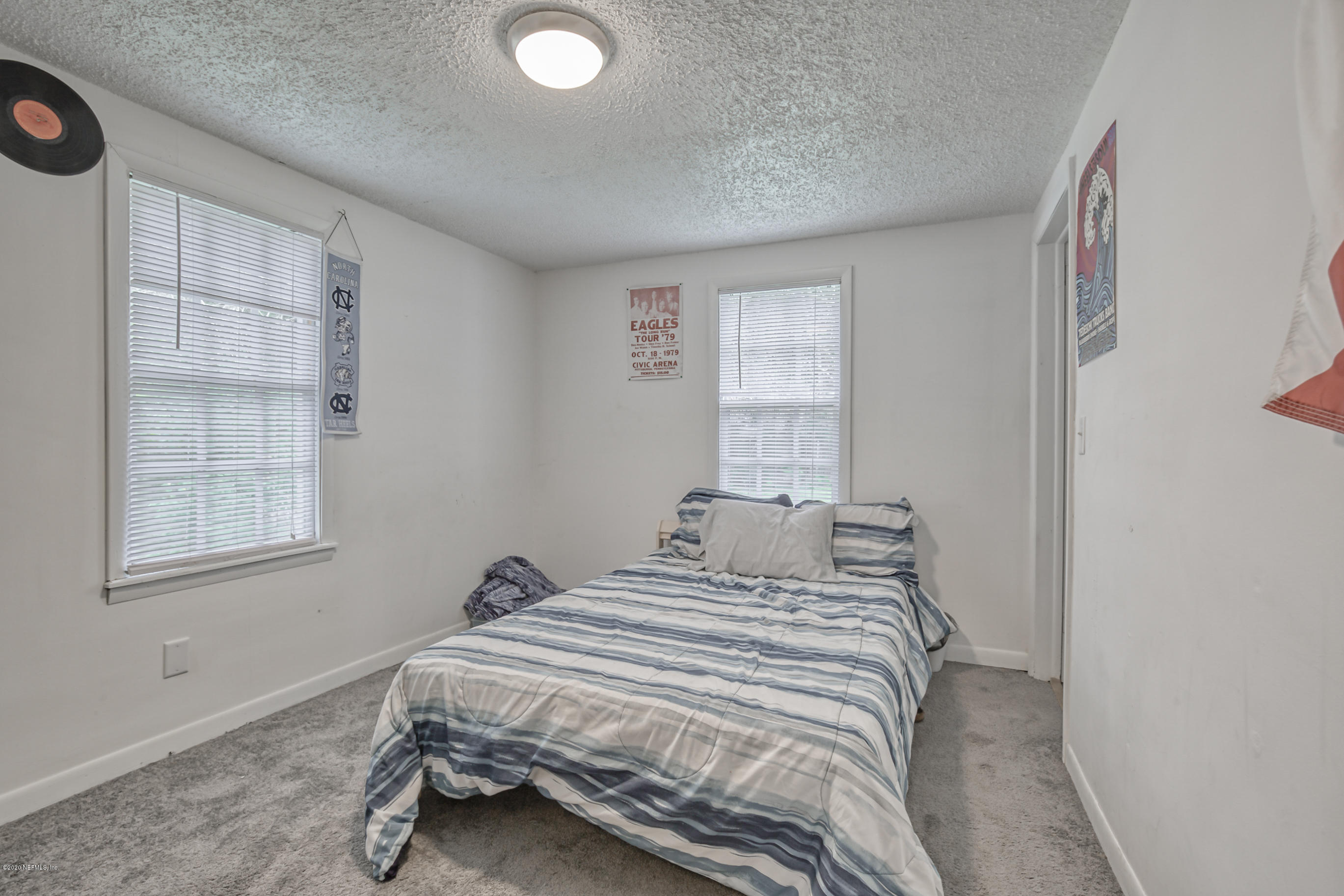 4571 Appleton Avenue Jacksonville, FL 32210 - Photo 19 of 30 a bedroom with a bed and a window