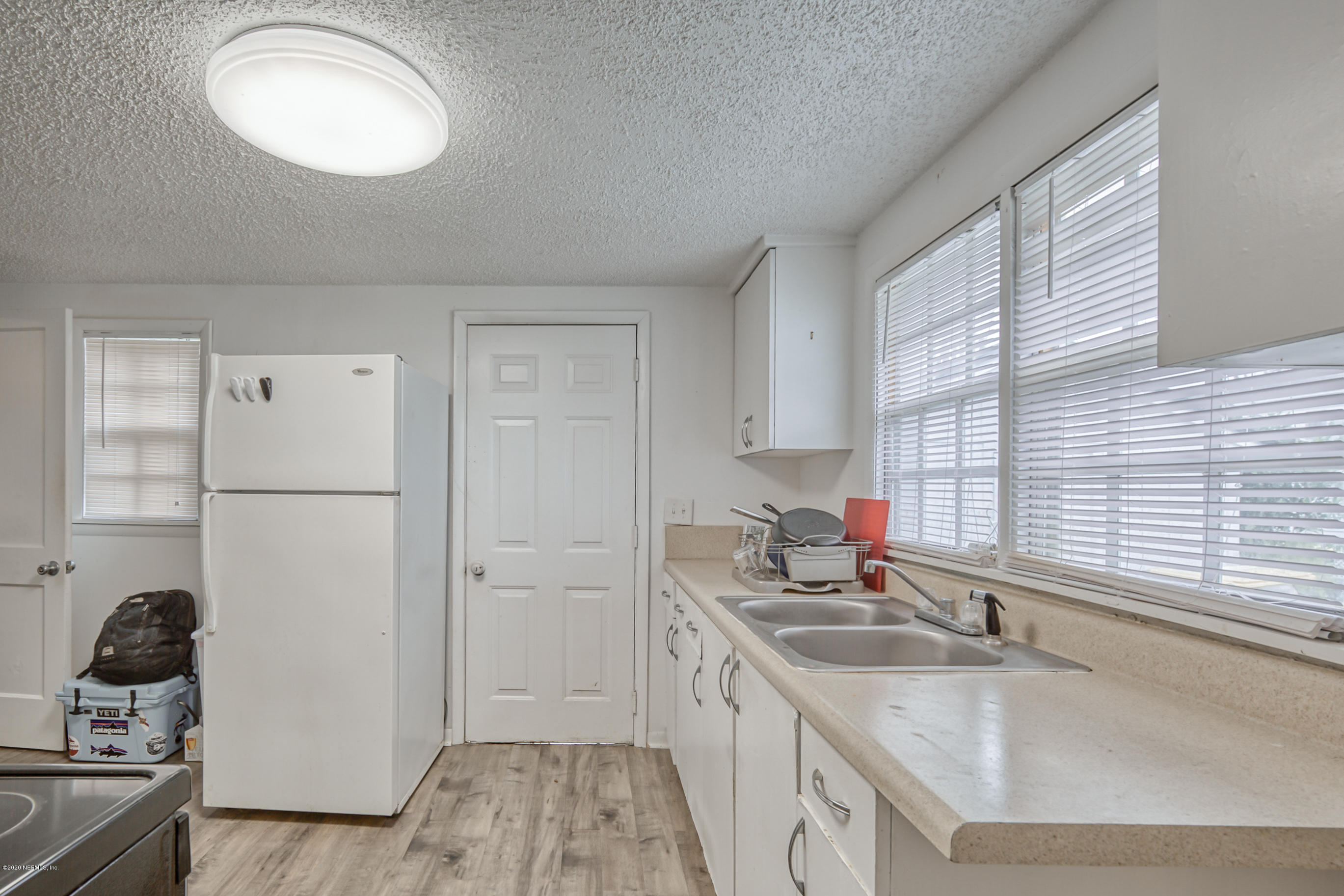 4571 Appleton Avenue Jacksonville, FL 32210 - Photo 23 of 30 a kitchen with a sink cabinets and window