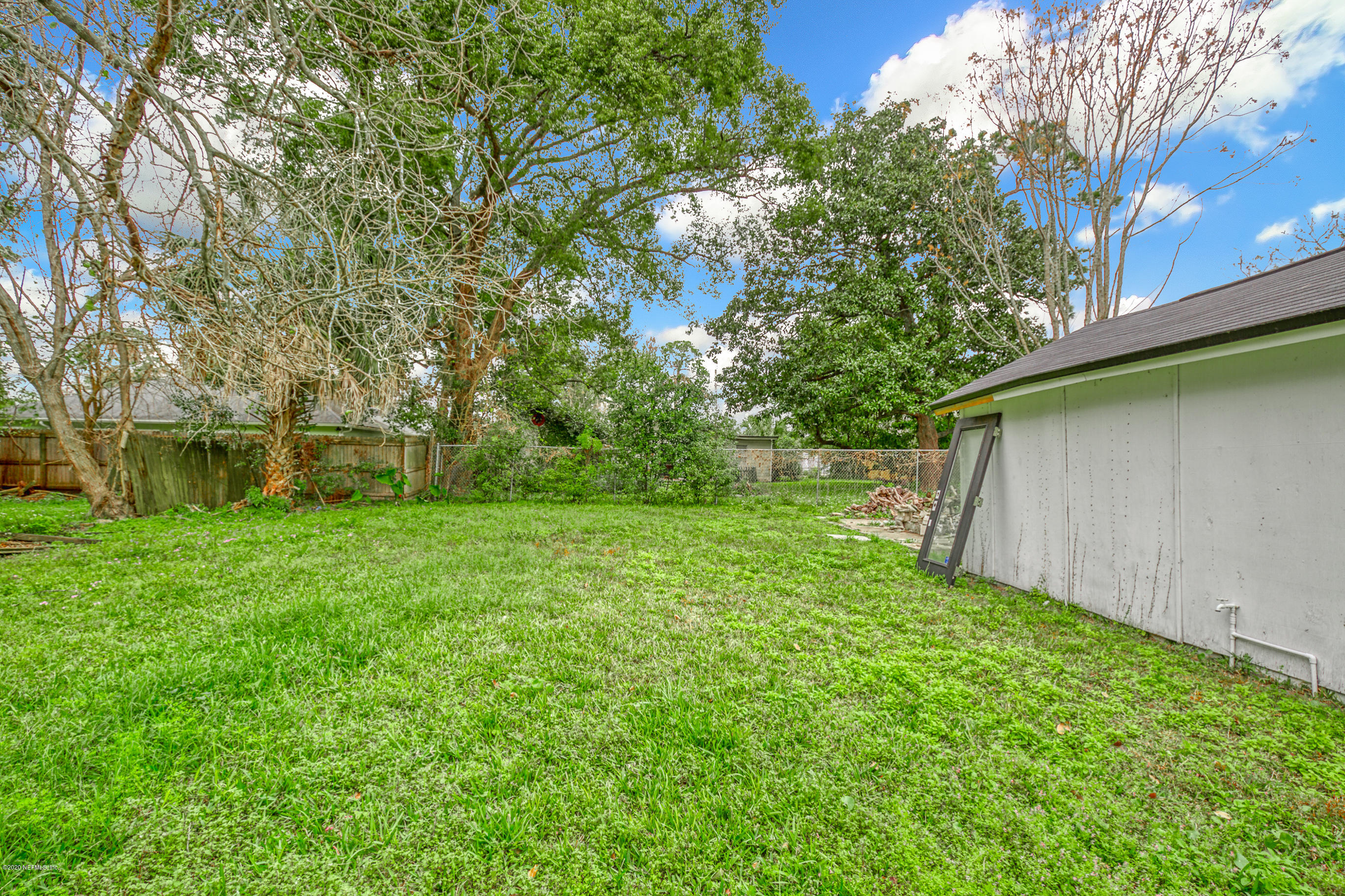 4571 Appleton Avenue Jacksonville, FL 32210 - Photo 28 of 30 a view of a backyard with large trees