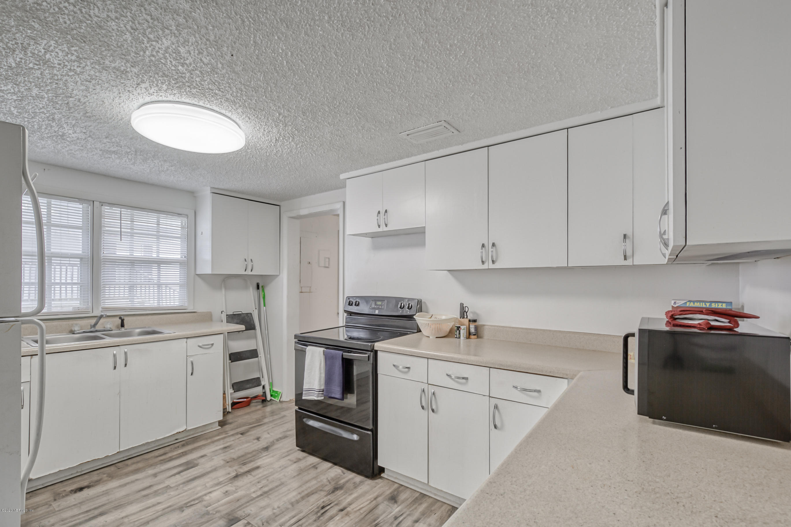 4571 Appleton Avenue Jacksonville, FL 32210 - Photo 5 of 30 a kitchen with cabinets stainless steel appliances and a sink