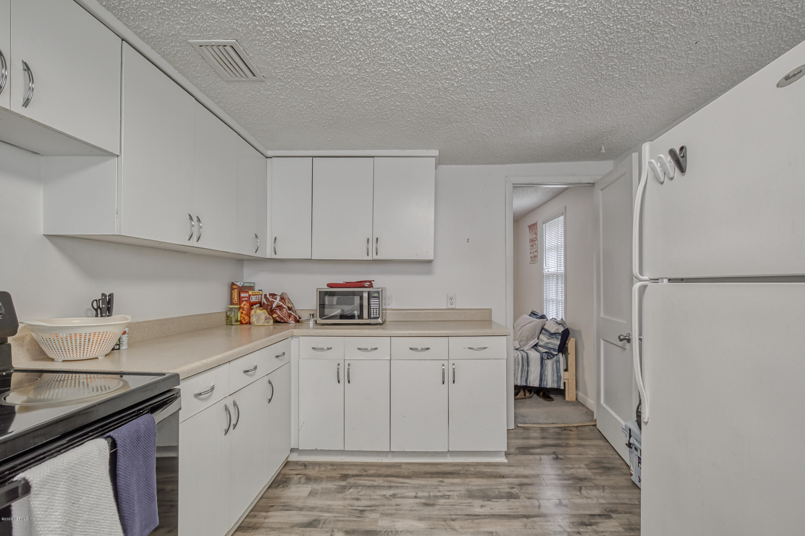 4571 Appleton Avenue Jacksonville, FL 32210 - Photo 6 of 30 a kitchen with a sink a stove and refrigerator