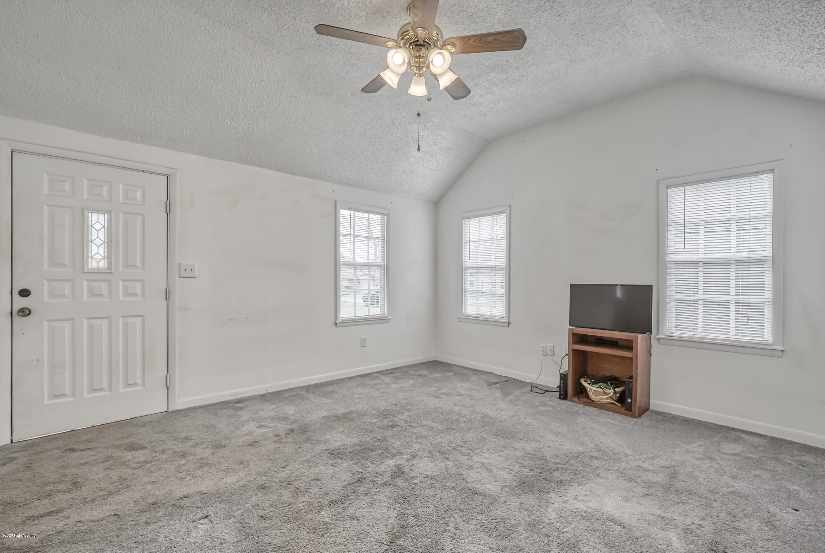 4571 Appleton Avenue Jacksonville, FL 32210 - Photo 10 of 30 a living room with furniture and a window