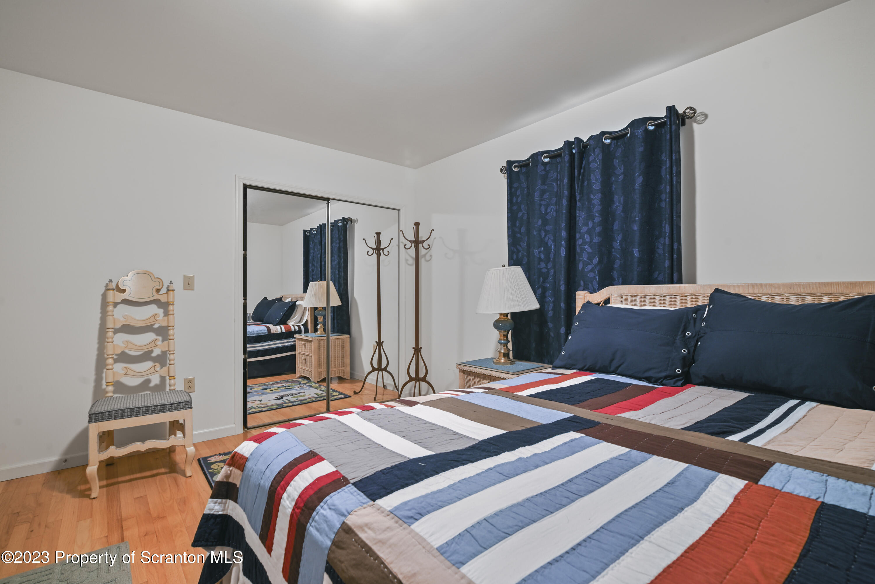210 Point Rd Lake Factoryville, PA 18419 - Photo 72 of 94 a bed sitting in a bedroom next to a window with closet