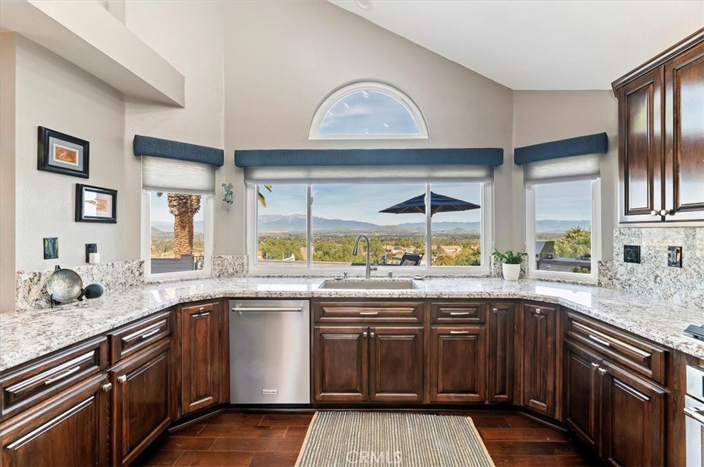 1793 Praed Street Riverside, CA 92503 - Photo 19 of 75 a kitchen with a sink stove and cabinets