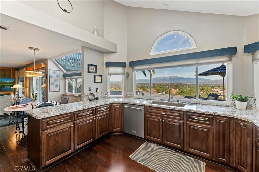 1793 Praed Street Riverside, CA 92503 - Photo 20 of 75 a kitchen with a sink stove and cabinets