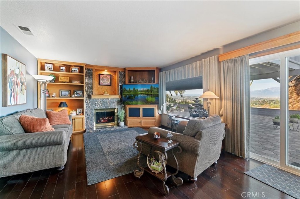 1793 Praed Street Riverside, CA 92503 - Photo 26 of 75 a living room with fireplace furniture and a wooden floor