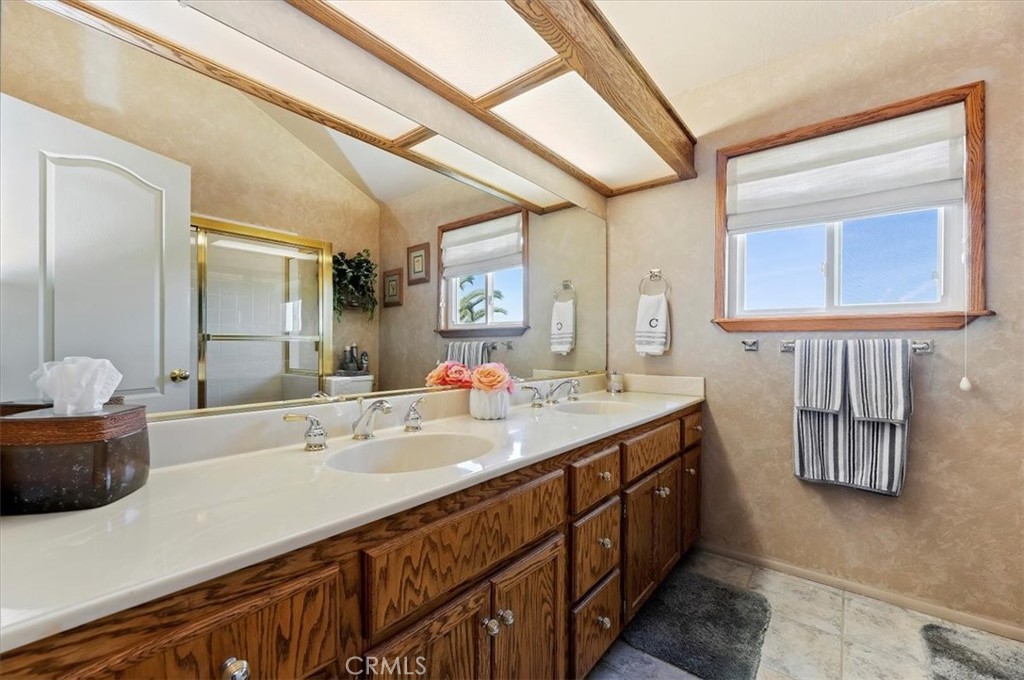 1793 Praed Street Riverside, CA 92503 - Photo 32 of 75 a bathroom with a double vanity sink and a mirror