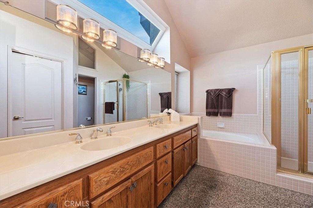 1793 Praed Street Riverside, CA 92503 - Photo 35 of 75 a bathroom with a tub double vanity and a mirror