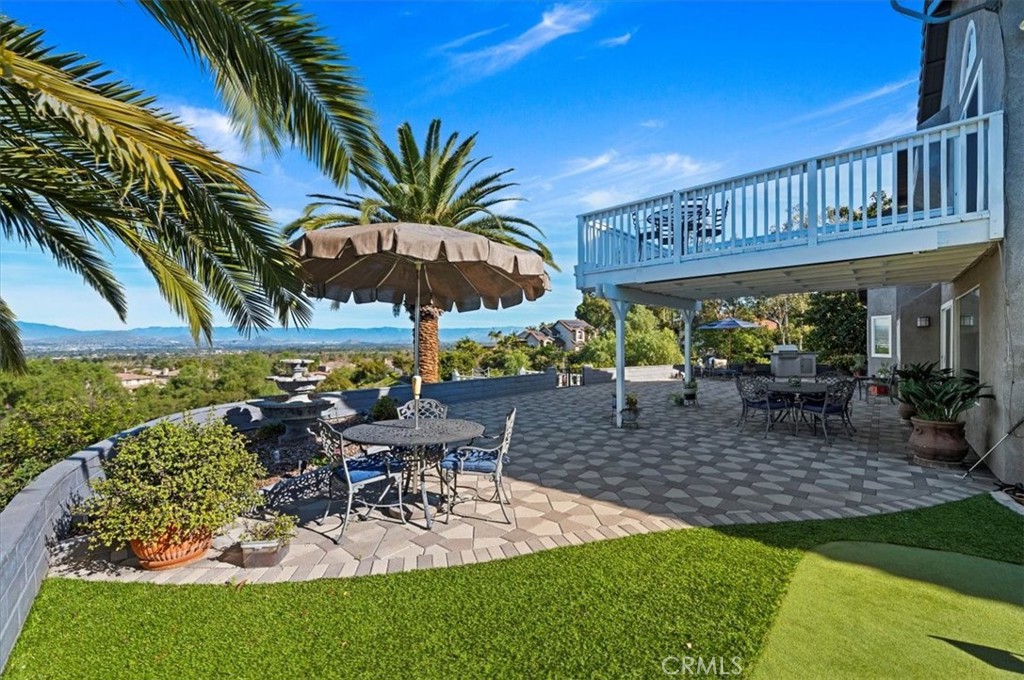1793 Praed Street Riverside, CA 92503 - Photo 40 of 75 a view of a backyard with a patio and dining space