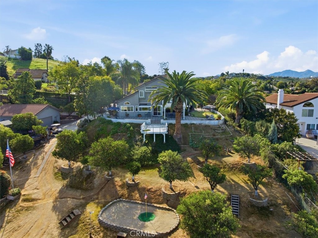 1793 Praed Street Riverside, CA 92503 - Photo 72 of 75 a backyard of a house with lots of green space and lake view