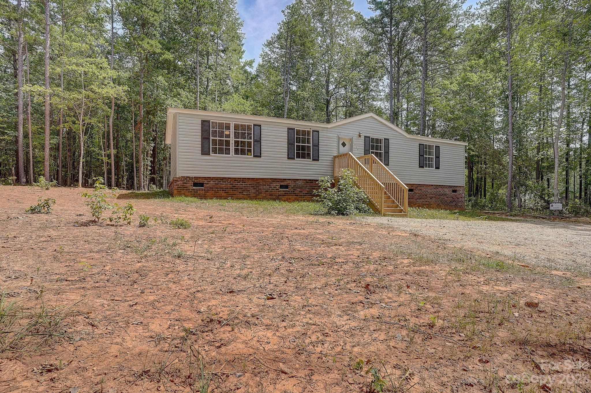 5959 Taxahaw Road Lancaster, SC 29720 - Photo 3 of 30 a view of a house with backyard
