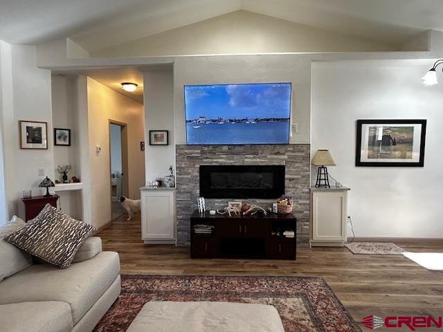 300 Southeast Sandstone Court Cedaredge, CO 81413 - Photo 15 of 38 a living room with furniture and a fireplace