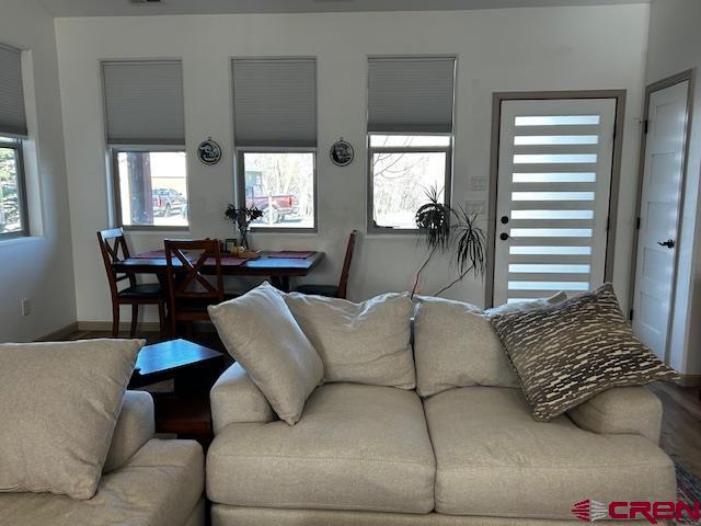 300 Southeast Sandstone Court Cedaredge, CO 81413 - Photo 18 of 38 a living room with furniture and a large window