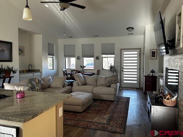 300 Southeast Sandstone Court Cedaredge, CO 81413 - Photo 20 of 38 a living room with fireplace furniture and a flat screen tv