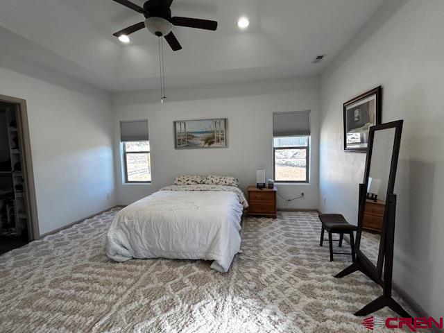 300 Southeast Sandstone Court Cedaredge, CO 81413 - Photo 24 of 38 a bedroom with a bed and a window