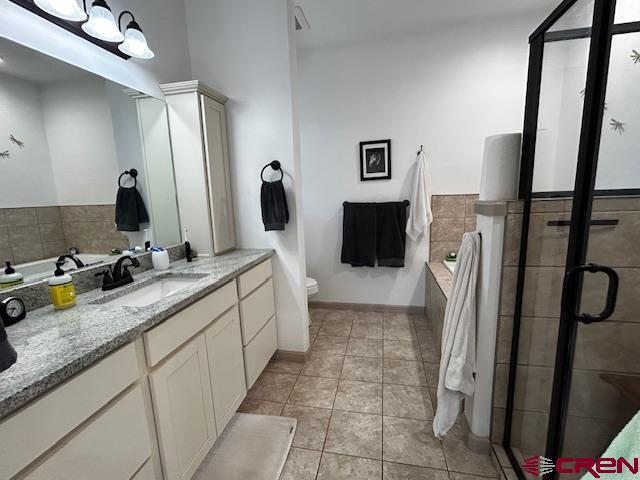 300 Southeast Sandstone Court Cedaredge, CO 81413 - Photo 26 of 38 a bathroom with a sink a mirror and a shower