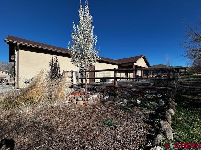 300 Southeast Sandstone Court Cedaredge, CO 81413 - Photo 5 of 38 a view of a house with a yard