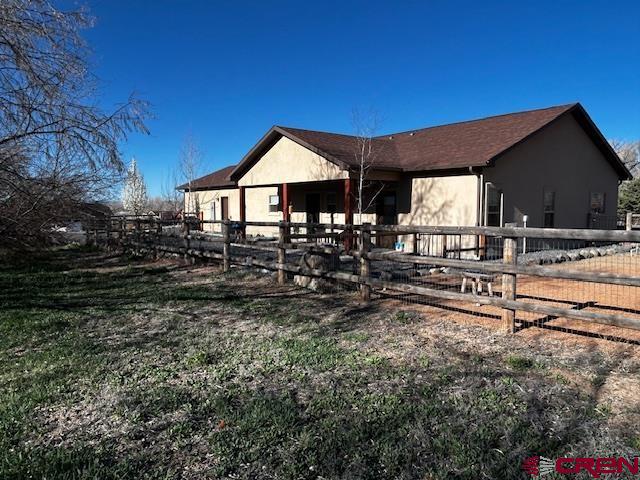 300 Southeast Sandstone Court Cedaredge, CO 81413 - Photo 6 of 38 a view of a house with a yard
