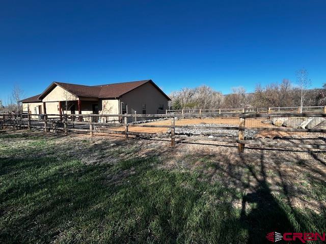 300 Southeast Sandstone Court Cedaredge, CO 81413 - Photo 7 of 38 a view of a house with a yard