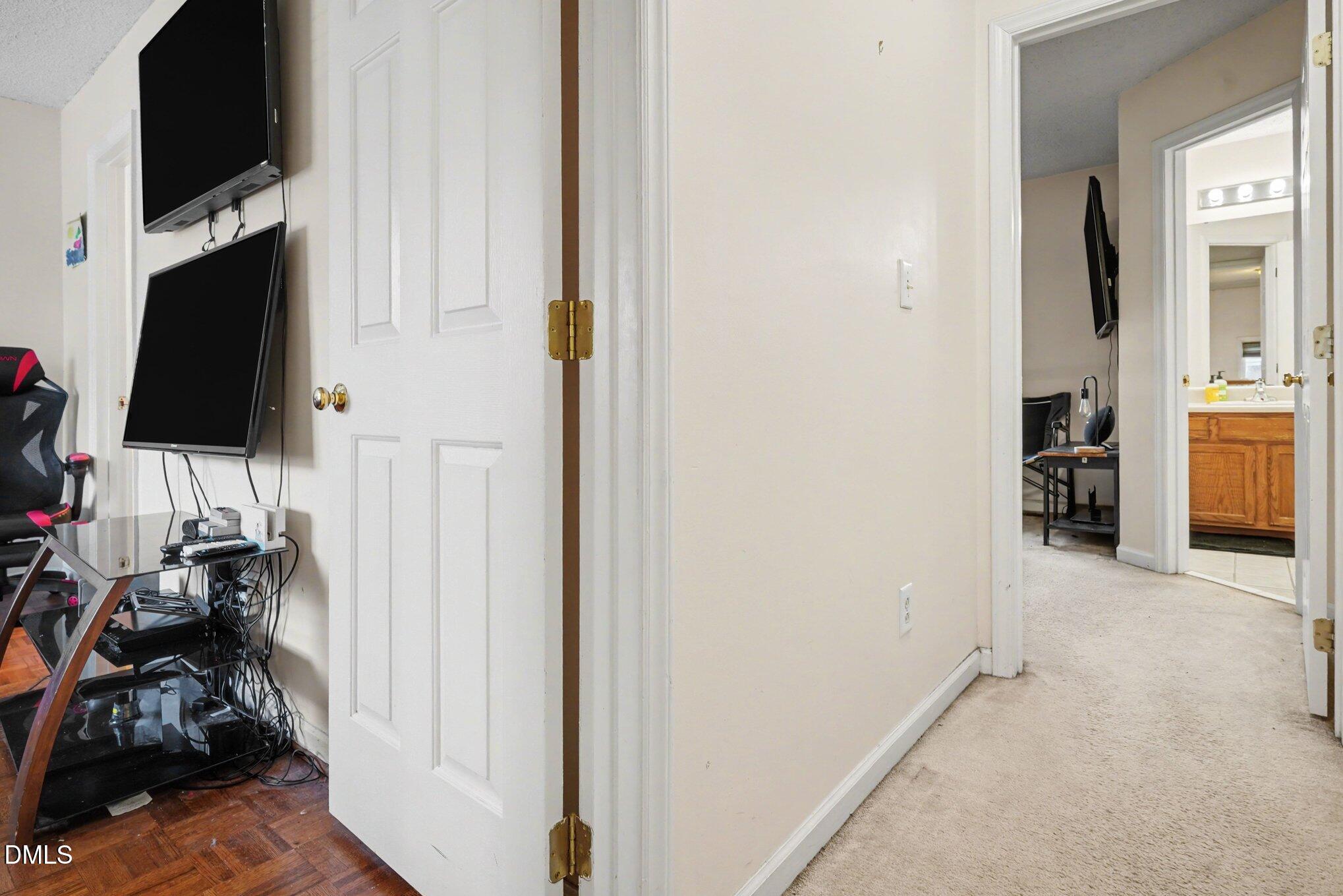 1502 Oakland Hills Way Raleigh, NC 27604 - Photo 20 of 26 a view of a livingroom with furniture and a flat screen tv
