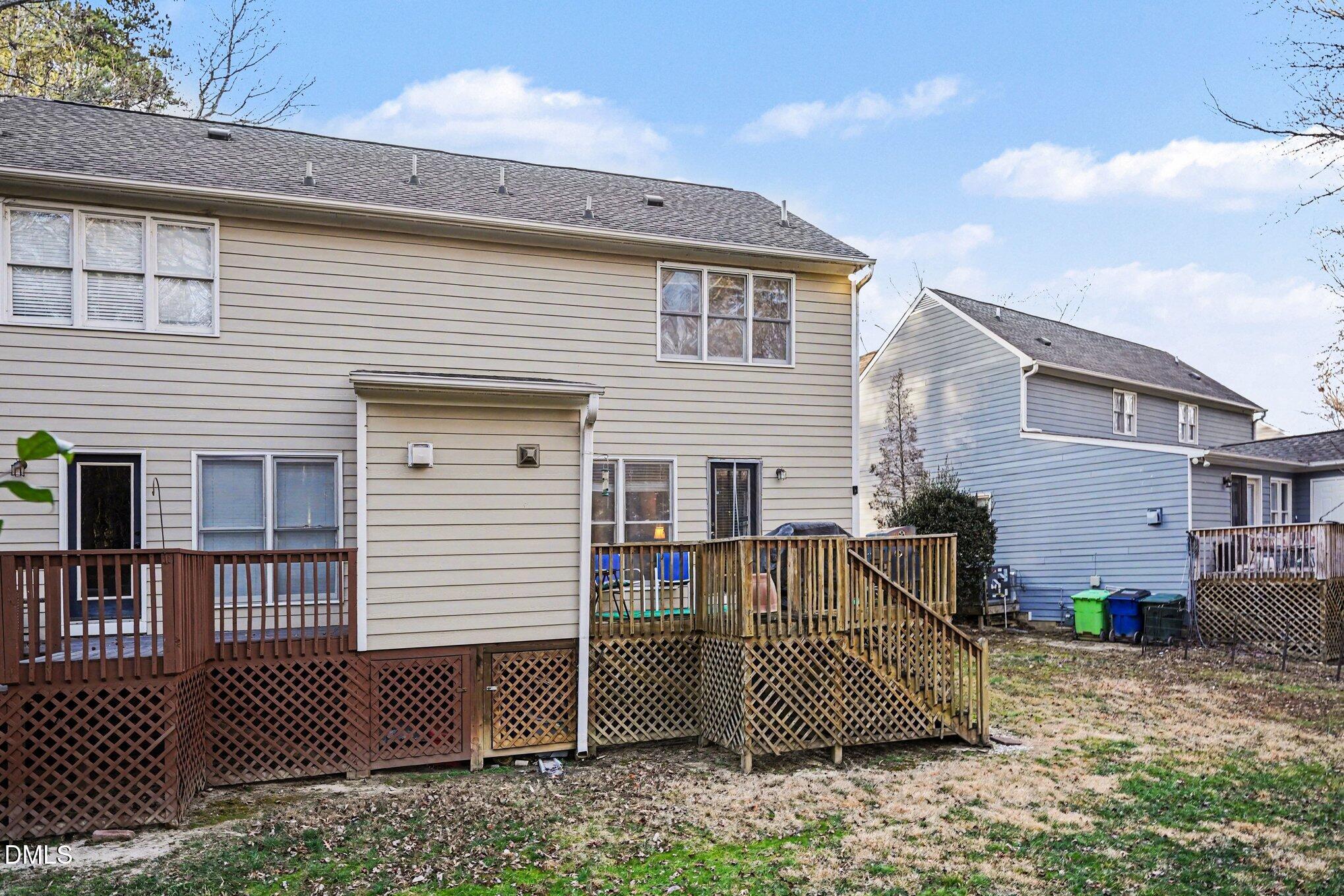 1502 Oakland Hills Way Raleigh, NC 27604 - Photo 24 of 26 a view of a house with a yard and wooden fence