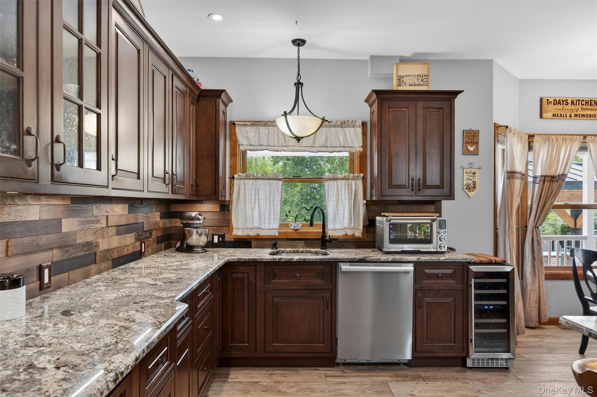 2 White Horse Road Middletown, NY 10940 - Photo 16 of 47 The kitchen showcases sweeping granite countertops, rich custom cabinetry, premium stainless steel appliances, and an abundance of workspace for cooking, baking, and gathering alike.