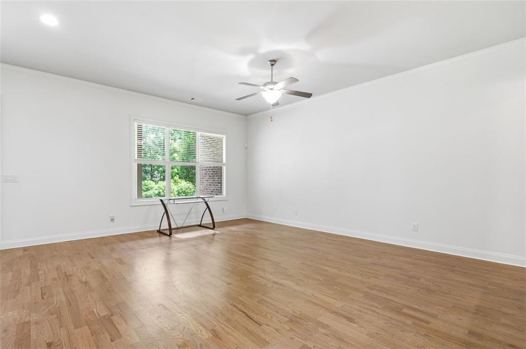 337 Rosshandler Road Suwanee, GA 30024 - Photo 30 of 45 wooden floor in an empty room with a window