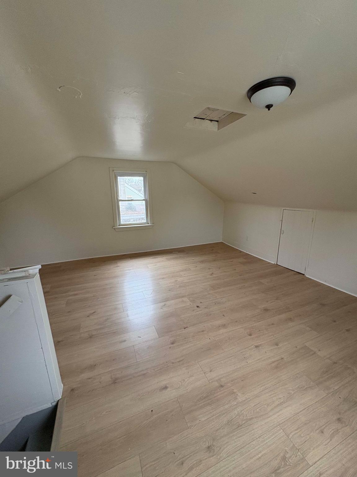 210 Wesley Street Salem, NJ 08079 - Photo 15 of 17 a view of an empty room with wooden floor and a window