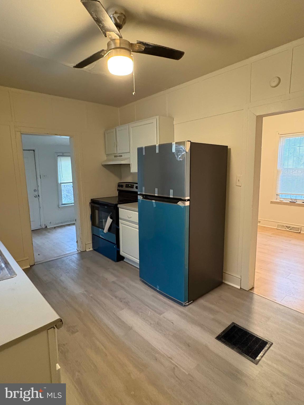 210 Wesley Street Salem, NJ 08079 - Photo 7 of 17 a kitchen with stainless steel appliances a refrigerator and a stove top oven