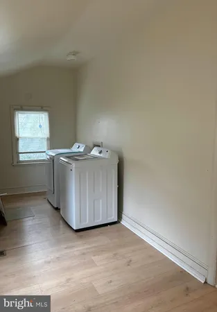 an empty room with wooden floor