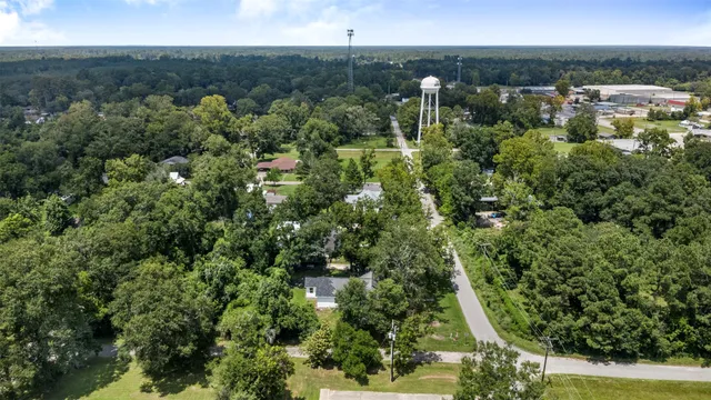 an aerial view of a house with garden space and sitting space