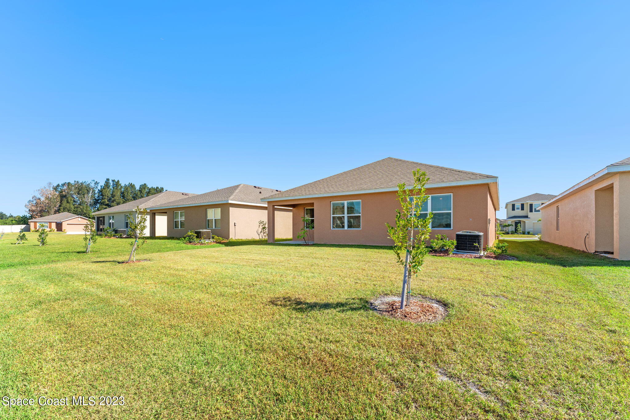 992 Trinity Street Rockledge, FL 32955 - Photo 12 of 19 a house with swimming pool in front of it