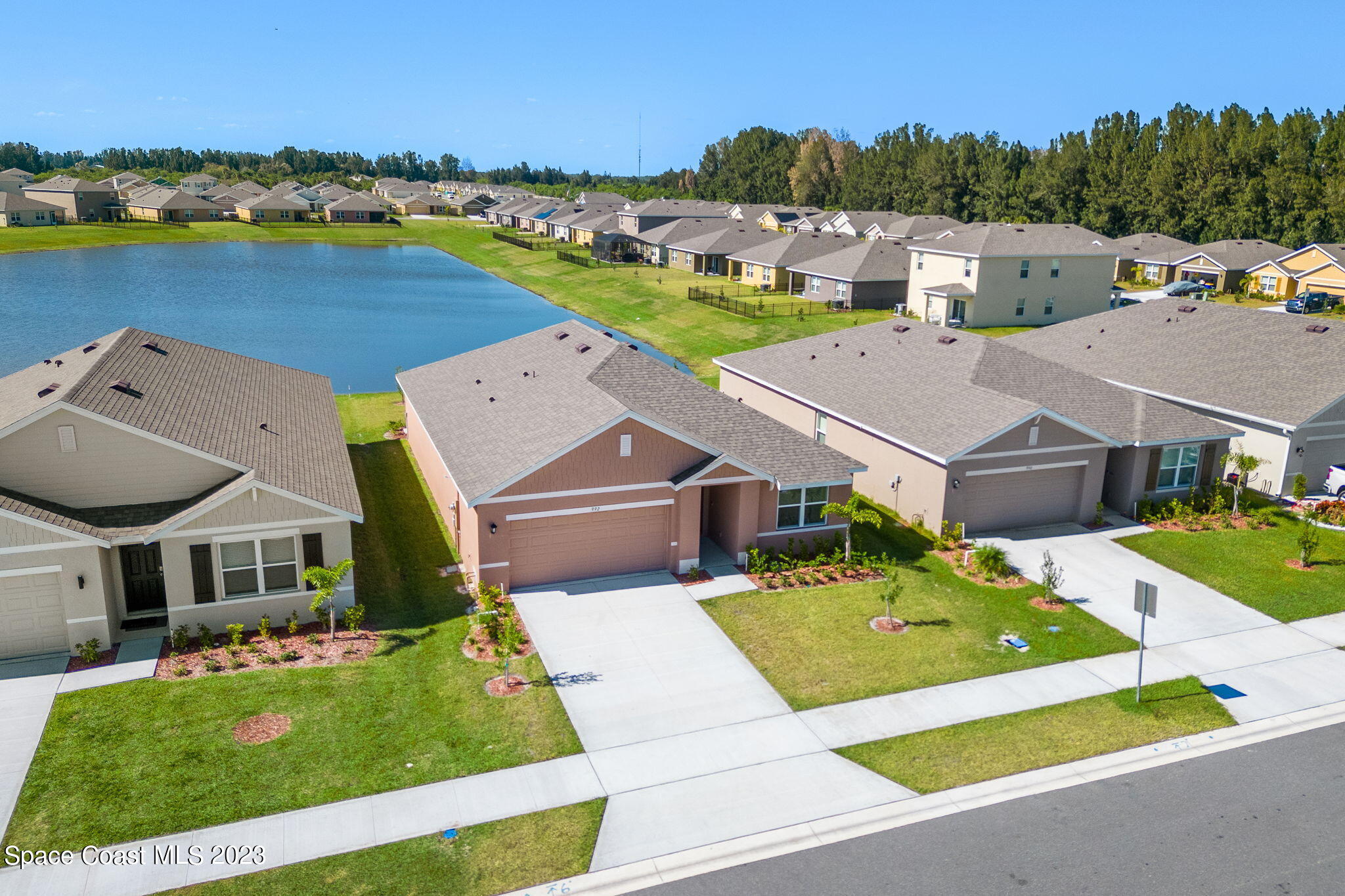 992 Trinity Street Rockledge, FL 32955 - Photo 13 of 19 an aerial view of a house with a garden and lake view