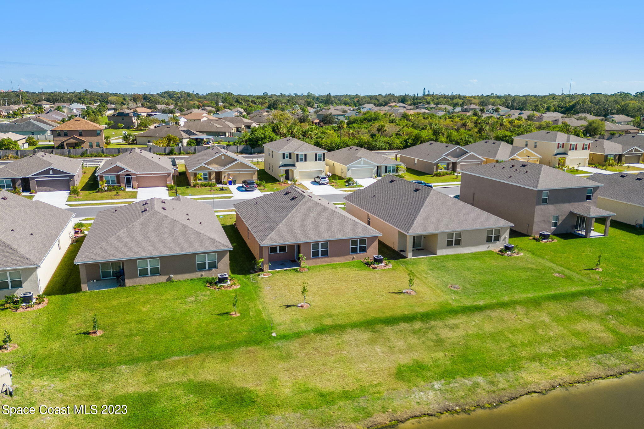 992 Trinity Street Rockledge, FL 32955 - Photo 15 of 19 an aerial view of residential houses with outdoor space