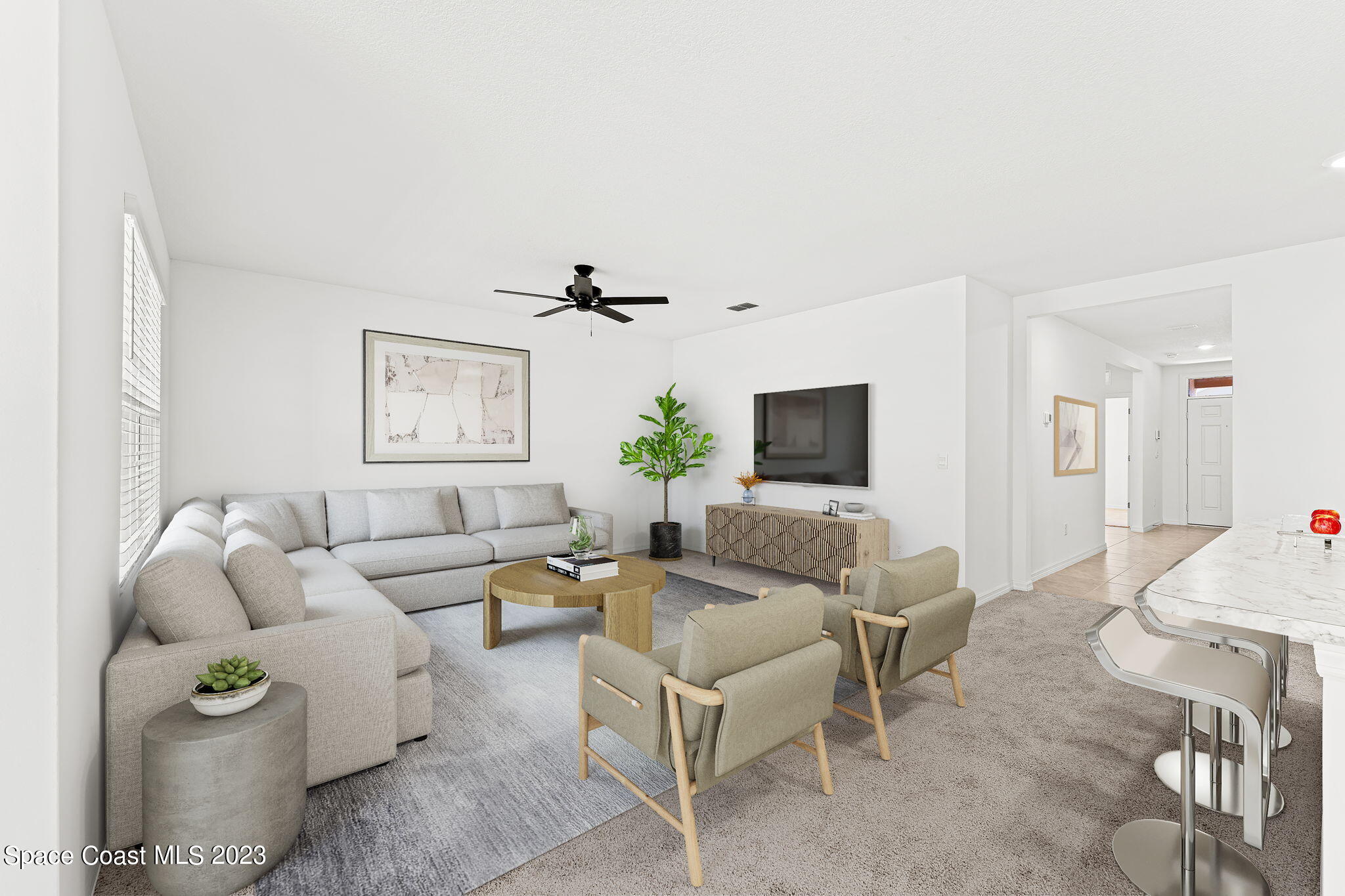 992 Trinity Street Rockledge, FL 32955 - Photo 4 of 19 a living room with furniture and a flat screen tv