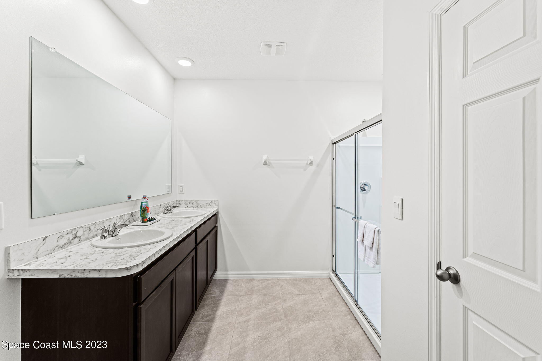 992 Trinity Street Rockledge, FL 32955 - Photo 6 of 19 a bathroom with a sink and a mirror