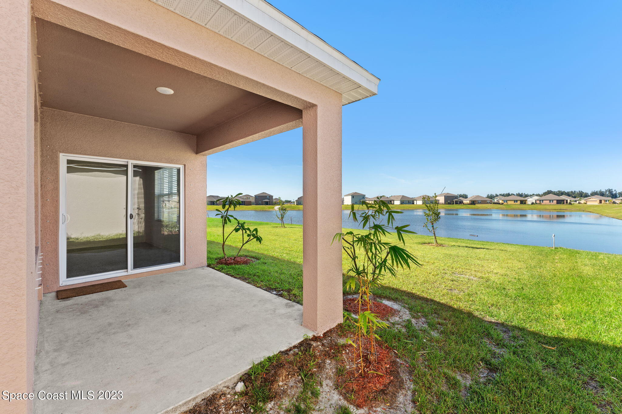 992 Trinity Street Rockledge, FL 32955 - Photo 10 of 19 a view of a room with floor to ceiling windows and yard