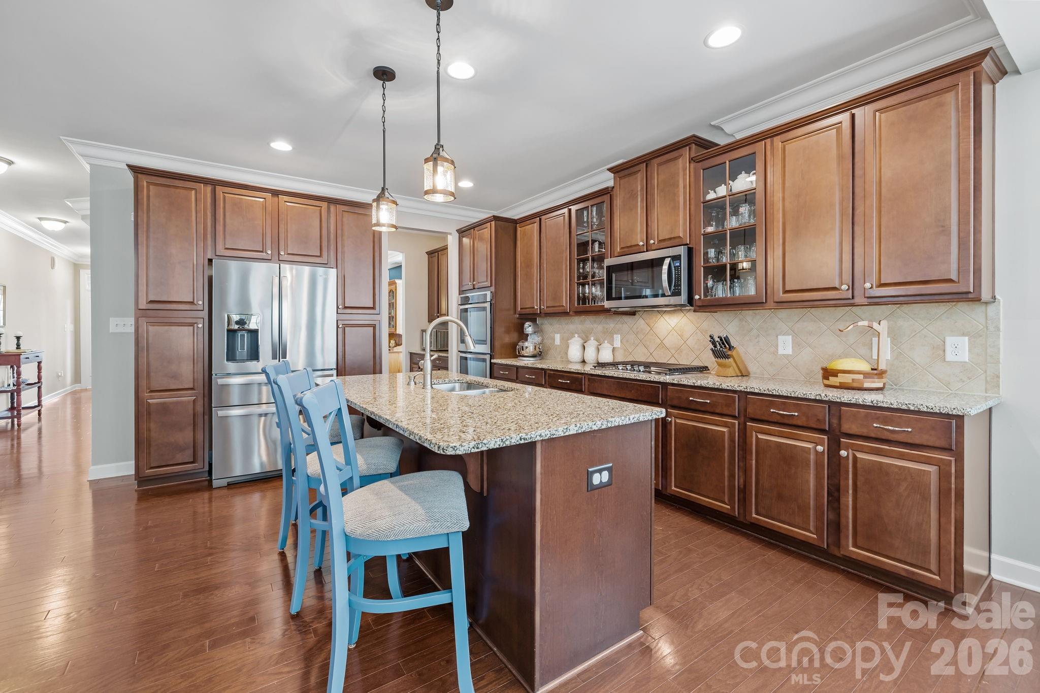 2072 Clarion Drive Fort Mill, SC 29707 - Photo 11 of 47 a kitchen with stainless steel appliances granite countertop a sink refrigerator and cabinets