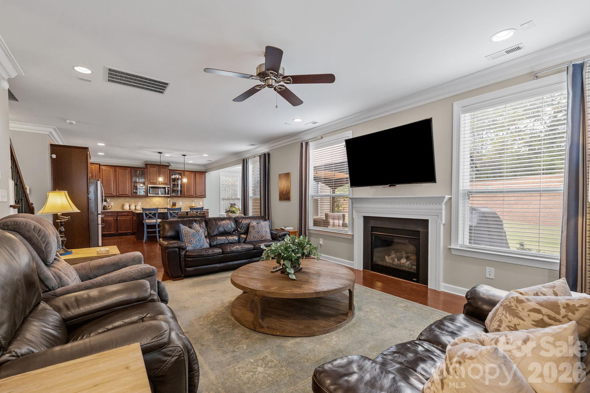 2072 Clarion Drive Fort Mill, SC 29707 - Photo 17 of 47 a living room with furniture a fireplace and a flat screen tv