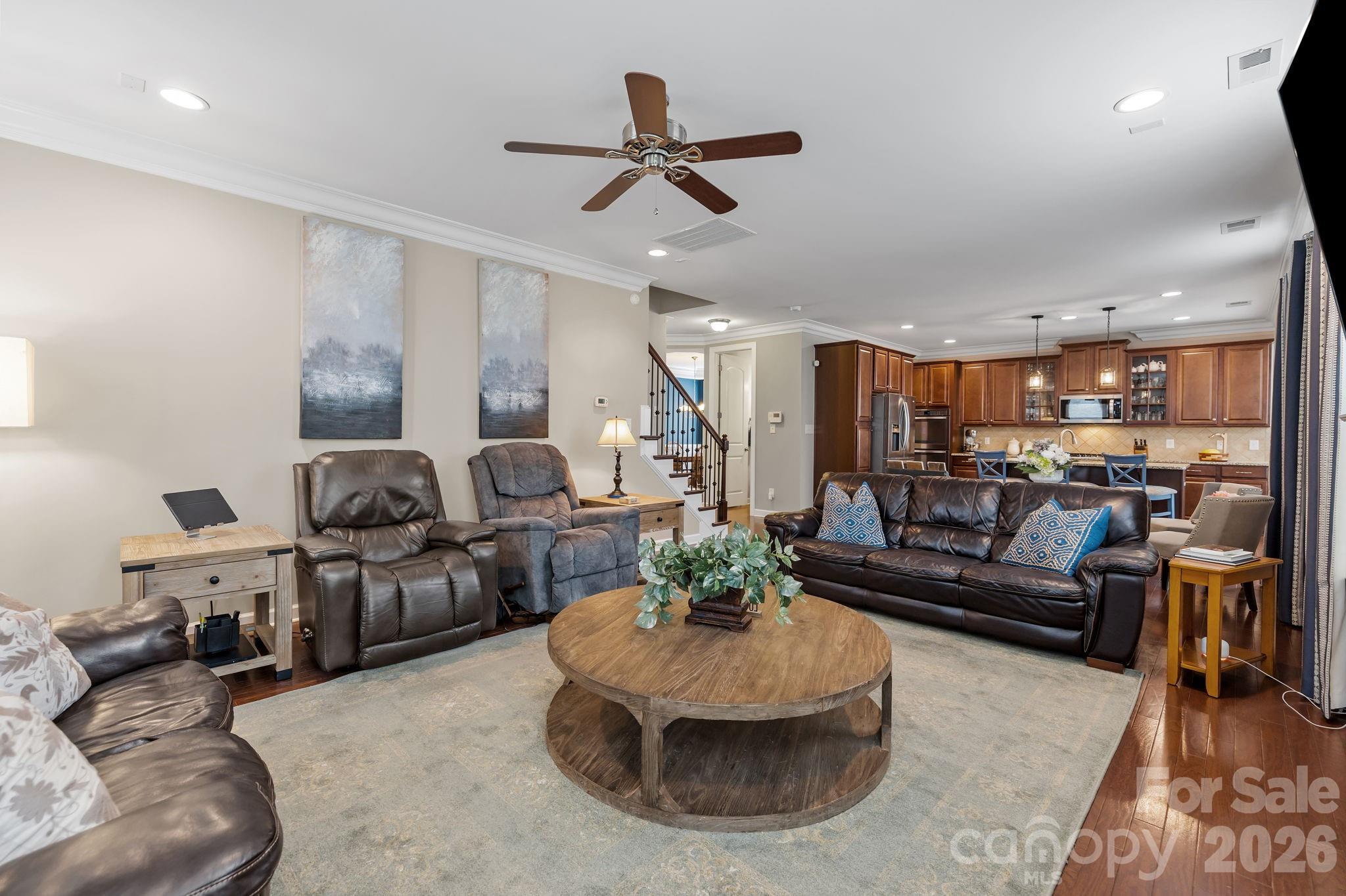 2072 Clarion Drive Fort Mill, SC 29707 - Photo 18 of 47 a living room with furniture kitchen view and a chandelier