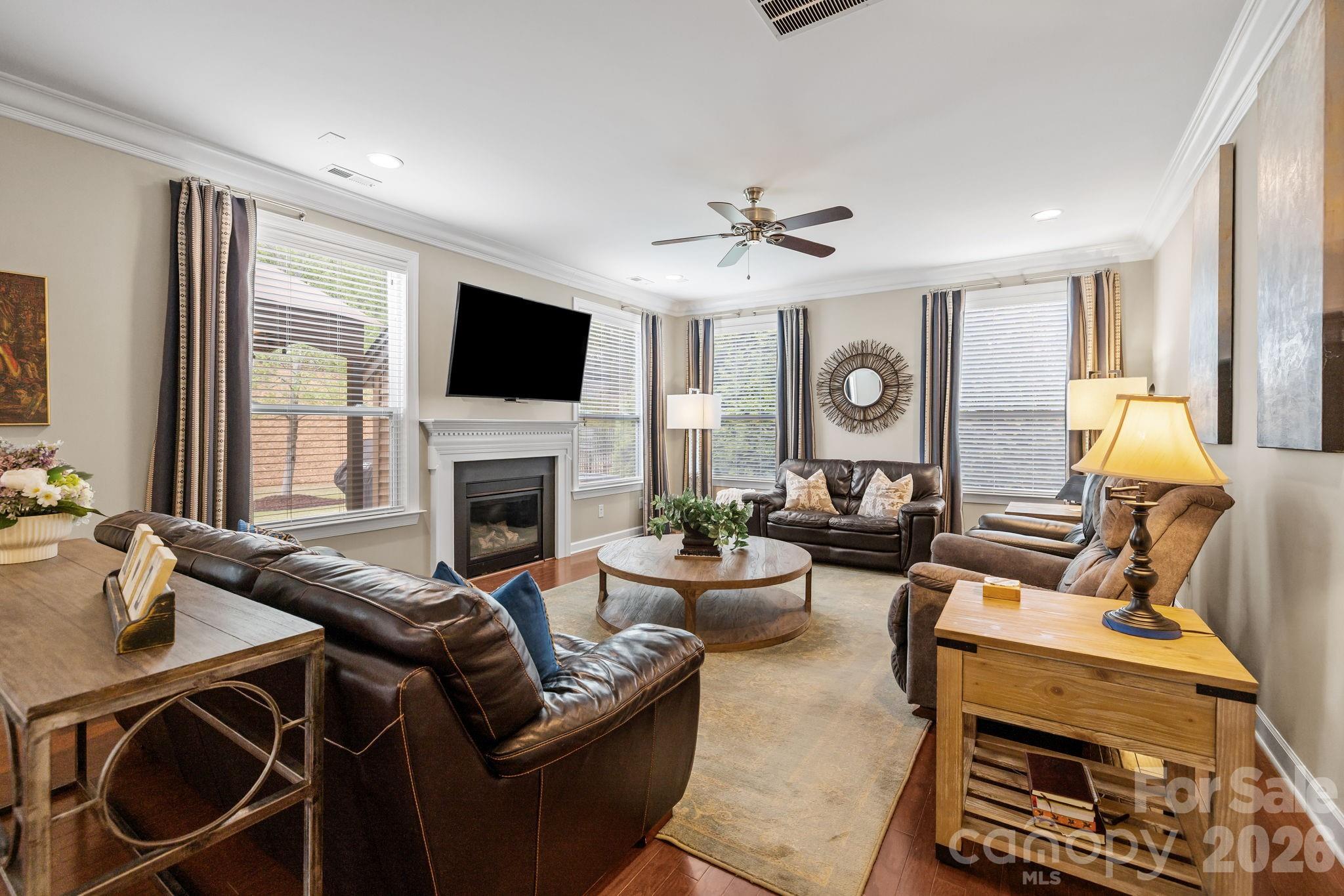 2072 Clarion Drive Fort Mill, SC 29707 - Photo 19 of 47 a living room with furniture a flat screen tv and a fireplace