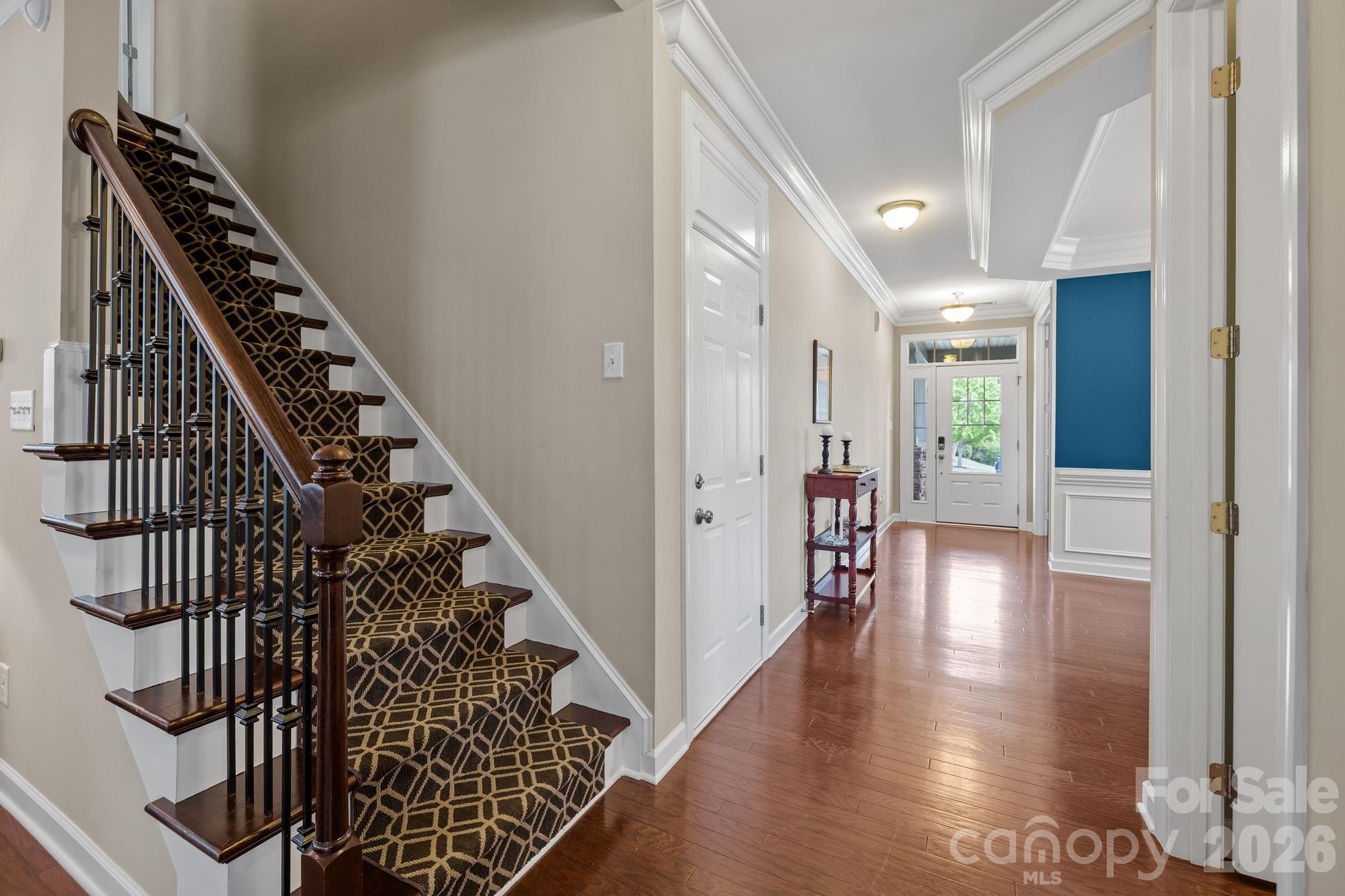 2072 Clarion Drive Fort Mill, SC 29707 - Photo 22 of 47 a view of a hallway with wooden floor and staircase