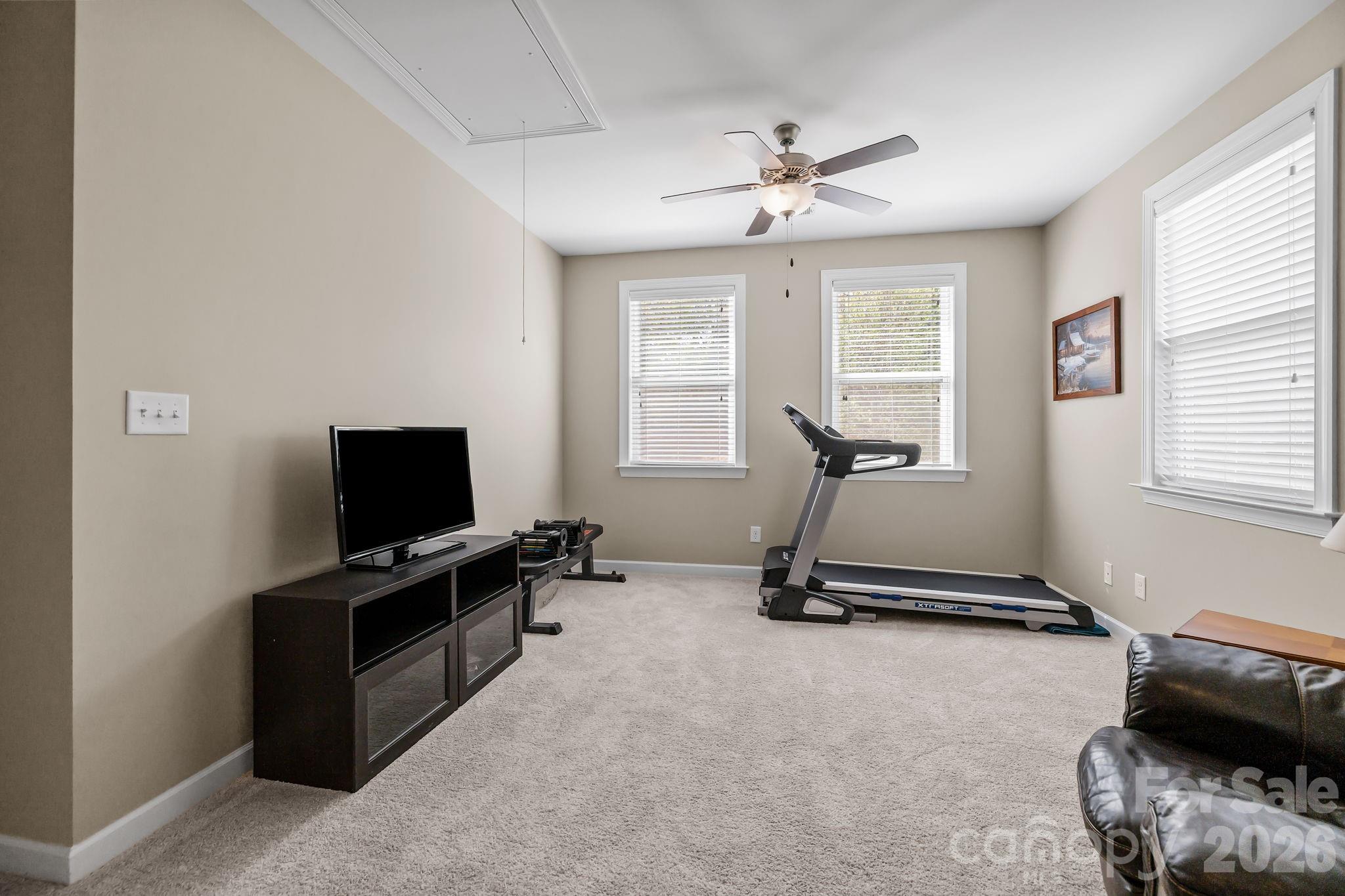 2072 Clarion Drive Fort Mill, SC 29707 - Photo 23 of 47 a room with gym equipment and a flat screen tv