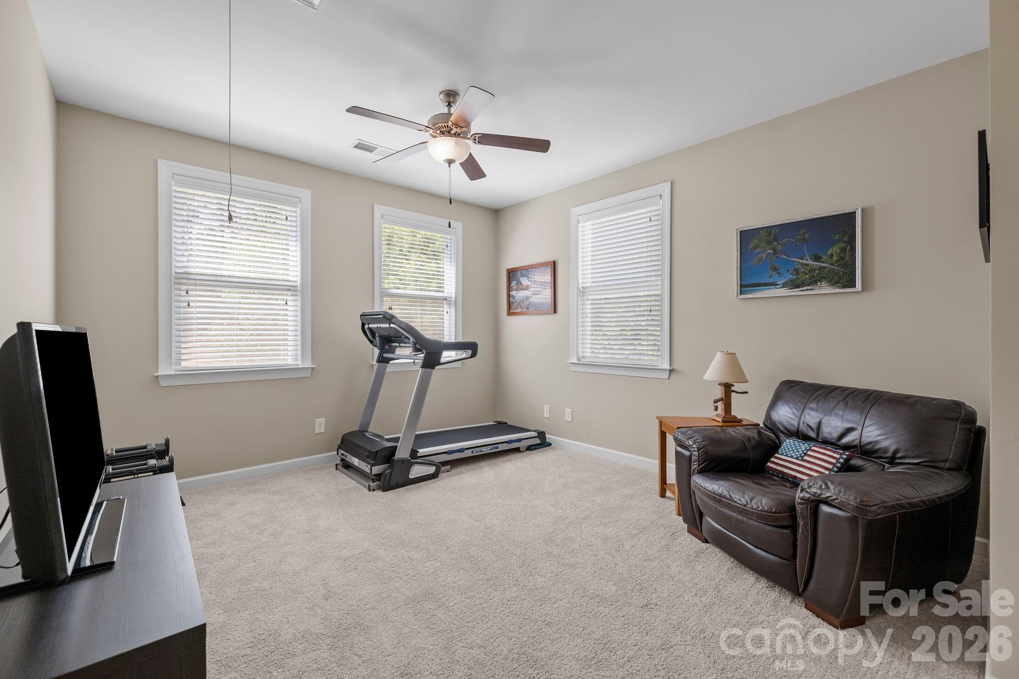 2072 Clarion Drive Fort Mill, SC 29707 - Photo 24 of 47 a living room with furniture gym equipment and a window