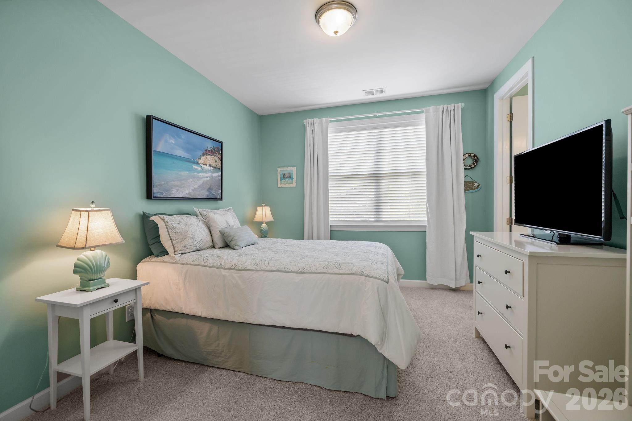 2072 Clarion Drive Fort Mill, SC 29707 - Photo 25 of 47 a bedroom with a bed and a flat tv screen on dresser